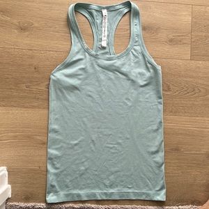 SWIFTLY TECH RACERBACK 2.0
New w/o tags color is hazy jade 
Size 6